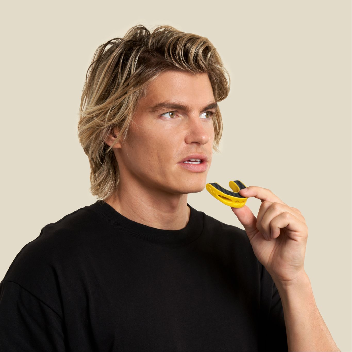 A man about to put the full face trainer level 2 in his mouth