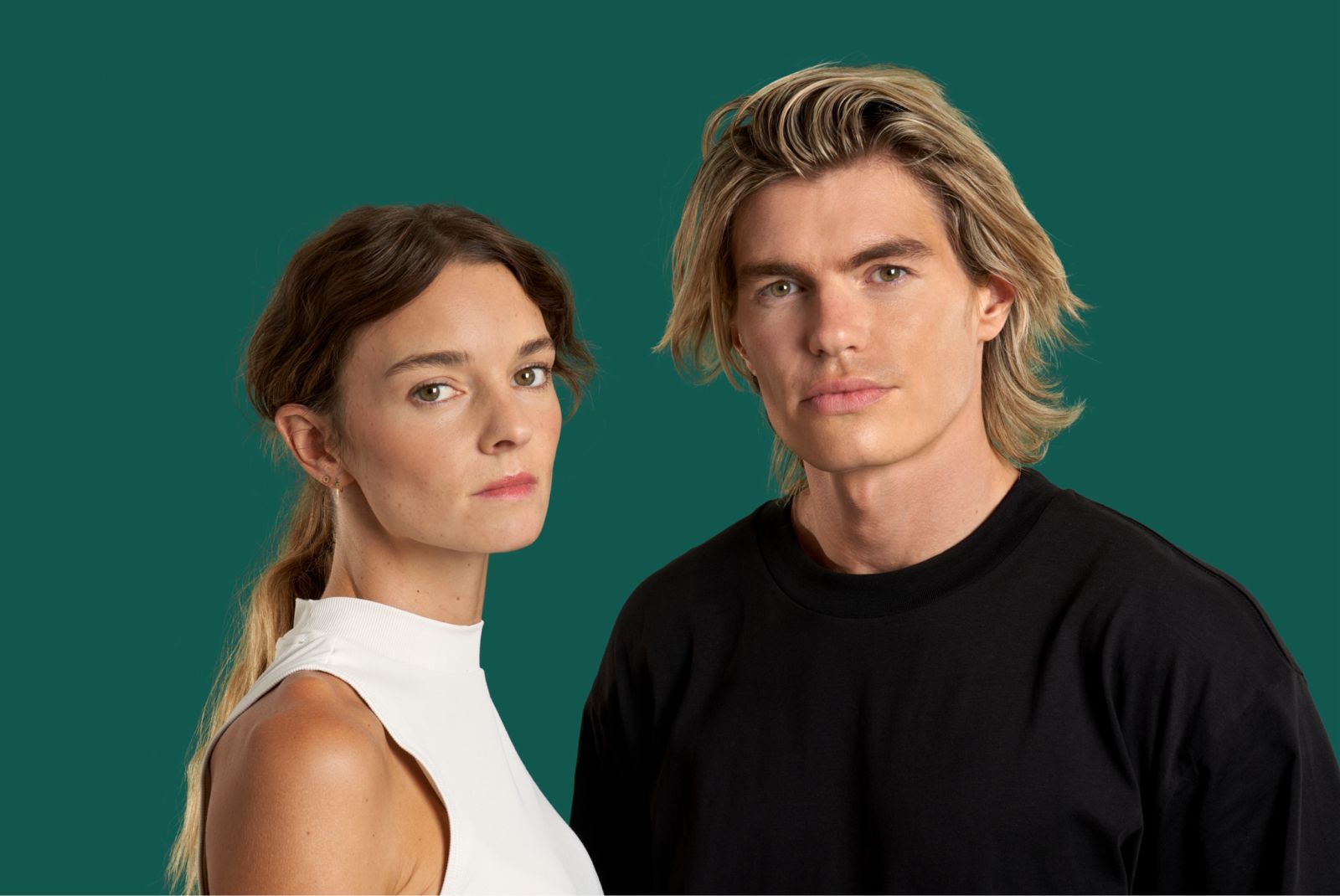 Two people standing side by side with defined jawlines