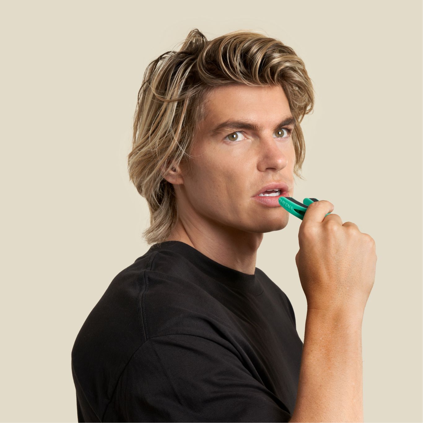 A man about to put the full face trainer level 3 in his mouth