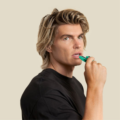 A man about to put the full face trainer level 3 in his mouth