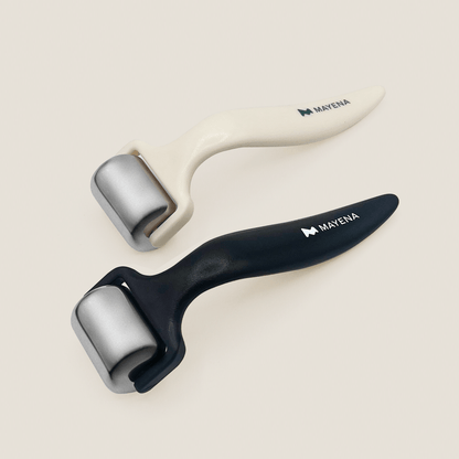 Two skin care rollers for the face with black and beige handles