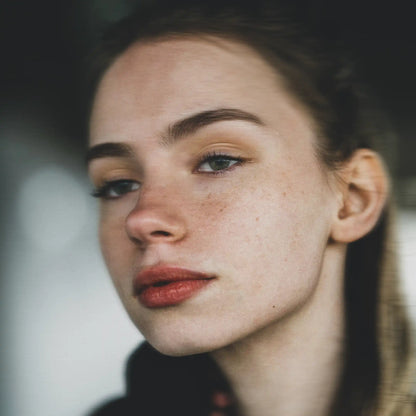 Close-up of a woman's face after exercising with a full face trainer