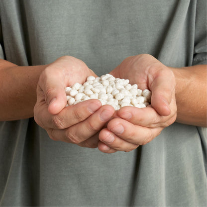 man holding hundreds of facial exerciser chewing gum in his hand