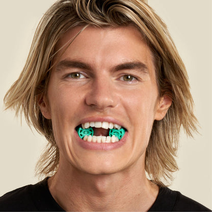 man doing jaw exercises with jawline core level 3