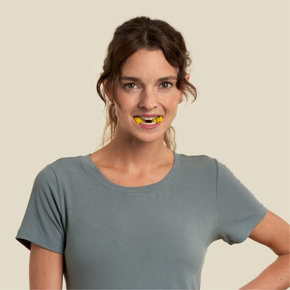 woman doing jaw exercises with jawline core level 2